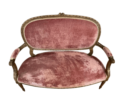 A small, ornate sofa with a curved back and seat upholstered in a dusty rose velvet fabric. The frame appears to be carved wood with a gilded finish. It has open arms with upholstered pads and is supported by four carved legs. — 3D model
