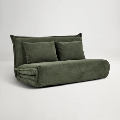 A convertible sofa bed upholstered in dark green corduroy fabric. The piece features a low profile with a rolled armrest/base and a fold-out mattress configuration. It includes two rectangular throw pillows that match the upholstery. — 3D model
