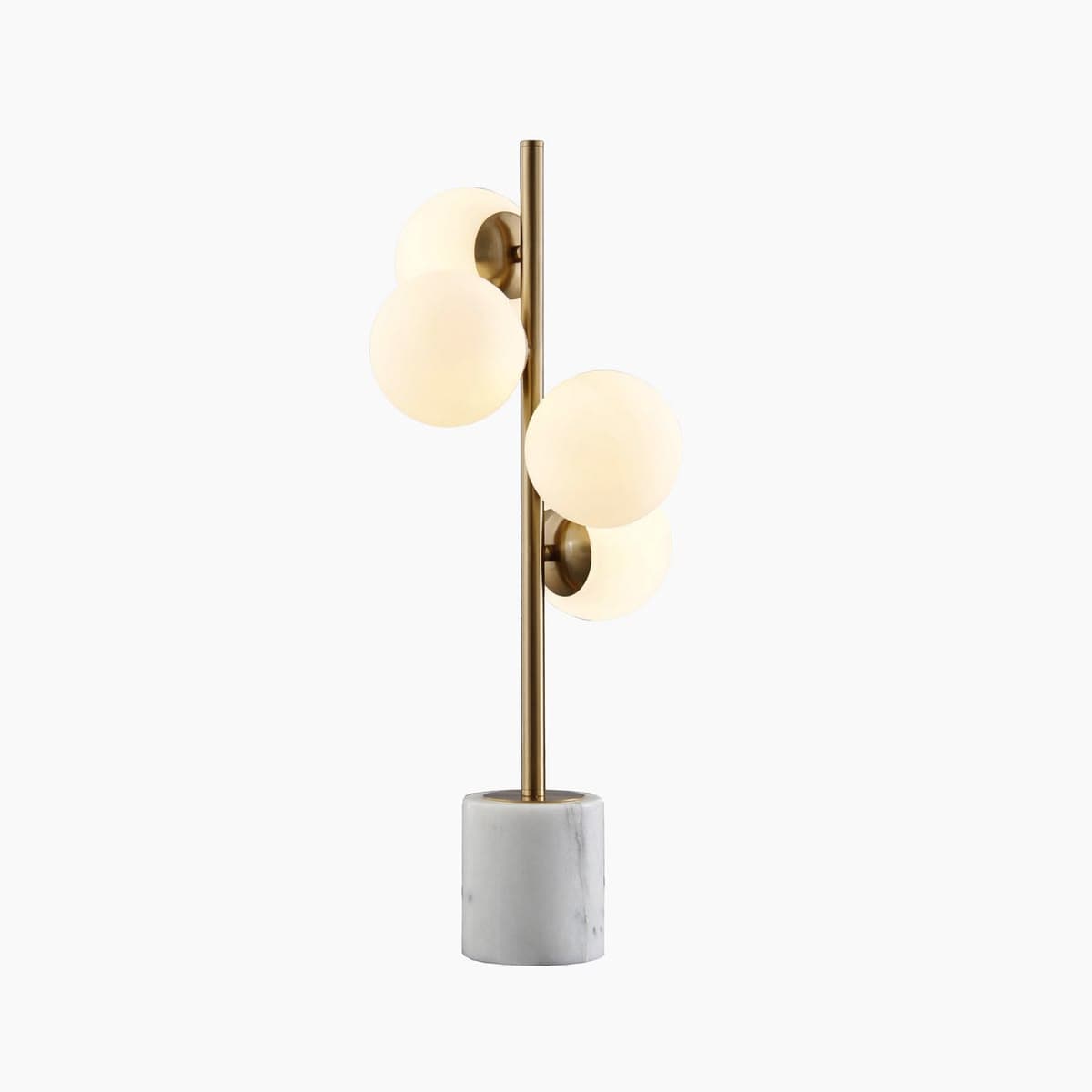 A modern table lamp featuring a cylindrical white marble base, a slender vertical brass-finished stem, and four spherical frosted glass diffusers arranged at varying heights along the stem. — 3D model