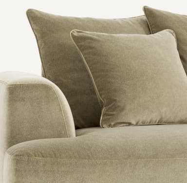 A contemporary sofa with a plush, upholstered finish. It features a three-seat configuration with deep cushions and multiple throw pillows for added comfort. The sofa is supported by dark, tapered legs, suggesting a modern or mid-century modern aesthetic. The upholstery appears to have a soft texture, possibly velvet or a similar fabric. — 3D model