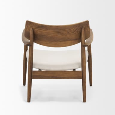 A classic Mid-Century Modern armchair featuring a gracefully curved wooden backrest and integrated armrests. The frame is constructed from a medium brown wood, possibly teak or walnut, with tapered legs. The seat is a removable cushion upholstered in a light, off-white fabric. — 3D model