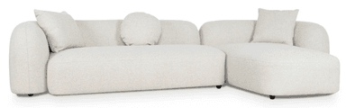 A contemporary modular sectional sofa featuring bouclé upholstery, a low profile, and soft, rounded edges, configured with a main sofa section and a right-hand chaise lounge. — 3D model