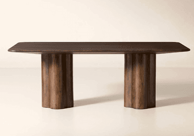 A dark stained wooden dining table featuring a rectangular top with rounded corners, supported by two cylindrical pedestal bases with vertical fluting. — 3D model