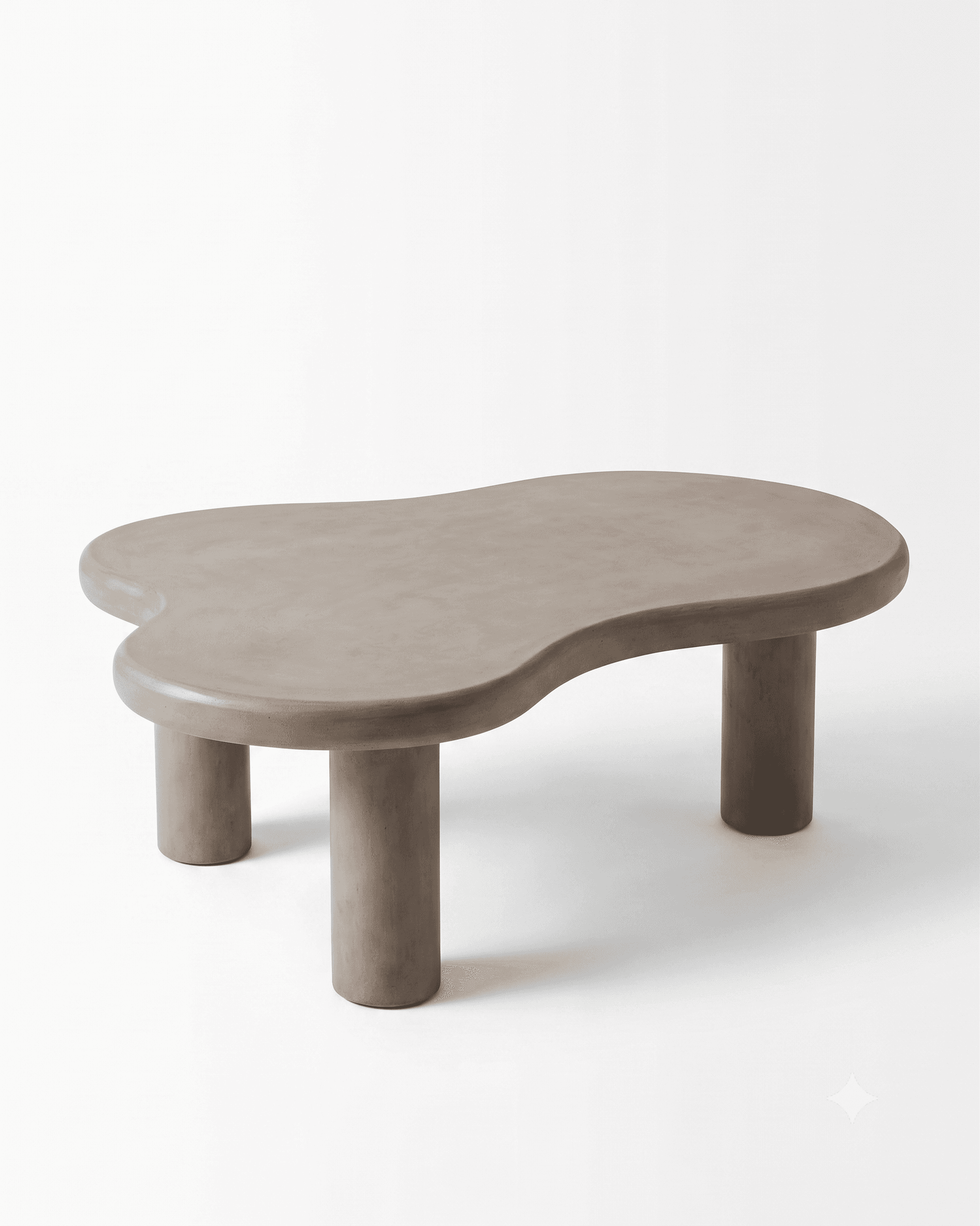 A low-profile coffee table with an irregular, organic, kidney-bean-like tabletop made from a matte, light taupe or greige concrete-like material. It is supported by three robust, cylindrical legs that seamlessly integrate into the underside of the tabletop, maintaining a sculptural and monolithic design. The edges of the tabletop are gently rounded. — 3D model