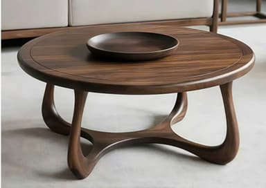 A round coffee table crafted from dark wood, featuring a smooth, circular tabletop with a subtly recessed, integrated round tray in the center. The table is supported by a distinctive sculptural base composed of interconnected, curvilinear wooden elements, giving it an organic and modern aesthetic. The wood displays a rich, dark brown tone with visible grain. — 3D model
