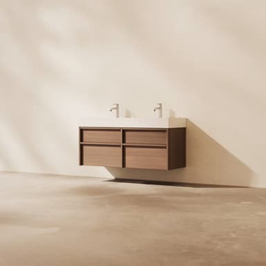 A modern, wall-mounted double sink bathroom vanity featuring a light wood cabinet with four drawers and a seamless white integrated countertop and sinks. Two chrome single-lever faucets are installed. — 3D model