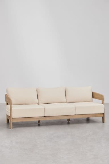 A three-seater sofa featuring a robust natural teak wood frame and three sets of light-colored, removable fabric cushions for the seat and back. The frame has a low profile with a continuous, rounded top rail forming the armrests and backrest, supported by vertical slats at the back. The sofa appears designed for outdoor or casual indoor use. — 3D model