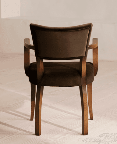 A wooden armchair with upholstered seat and backrest. The chair features curved armrests and four tapered legs. The upholstery is a dark brown fabric, and the wooden frame has a natural wood finish. — 3D model