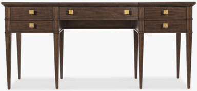 A dark brown wooden desk featuring a rectangular top, multiple drawers, and reeded tapered legs. The desk has a central knee space, flanked by two sections each containing two stacked drawers. Above the knee space, there is a single, shallower drawer. All drawers are fitted with square brass pulls featuring an etched geometric pattern. The reeded texture is present on the vertical elements of the frame and the tapered legs, adding a classical detail to the transitional design. — 3D model