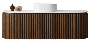 A contemporary wall-mounted bathroom vanity featuring a fluted wood cabinet, a white solid surface countertop, and a cylindrical white vessel sink, complemented by brass wall-mounted faucets. — 3D model