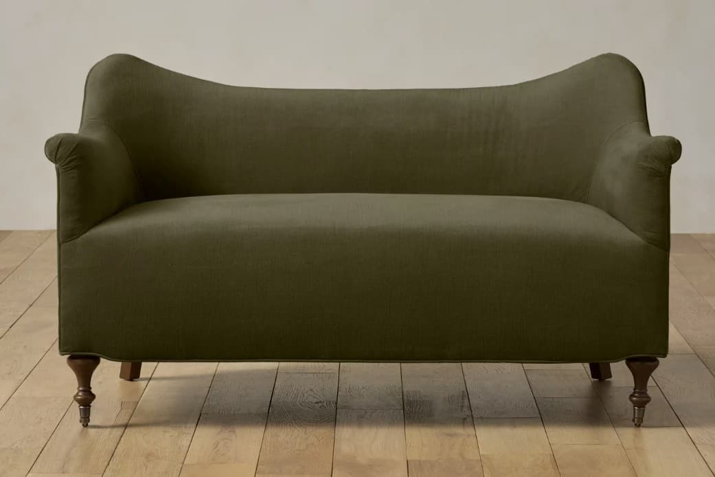 A two-seater sofa with a curved backrest and rolled arms. The sofa is upholstered in a textured fabric and features turned wooden legs. — 3D model