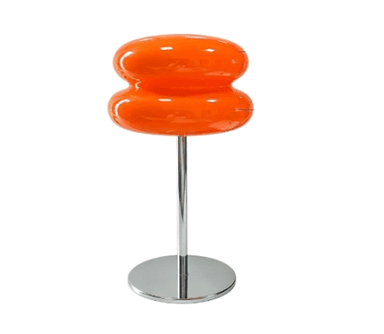 An illuminated table lamp featuring an orange, hourglass-shaped glass shade composed of two stacked, rounded sections. The shade is supported by a slender chrome-finished metal stem that rises from a flat, circular chrome base. The lamp emits a warm, diffused orange glow, indicative of its material and the light source within. — 3D model