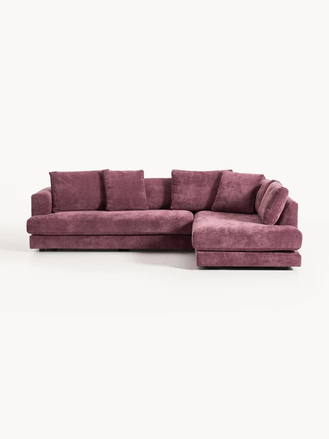 A modern sectional sofa upholstered in a rich plum-colored velvet-like fabric, featuring a left-hand facing chaise lounge. It has a low-profile design with thick, plush seat and back cushions, and wide, integrated armrests. — 3D model