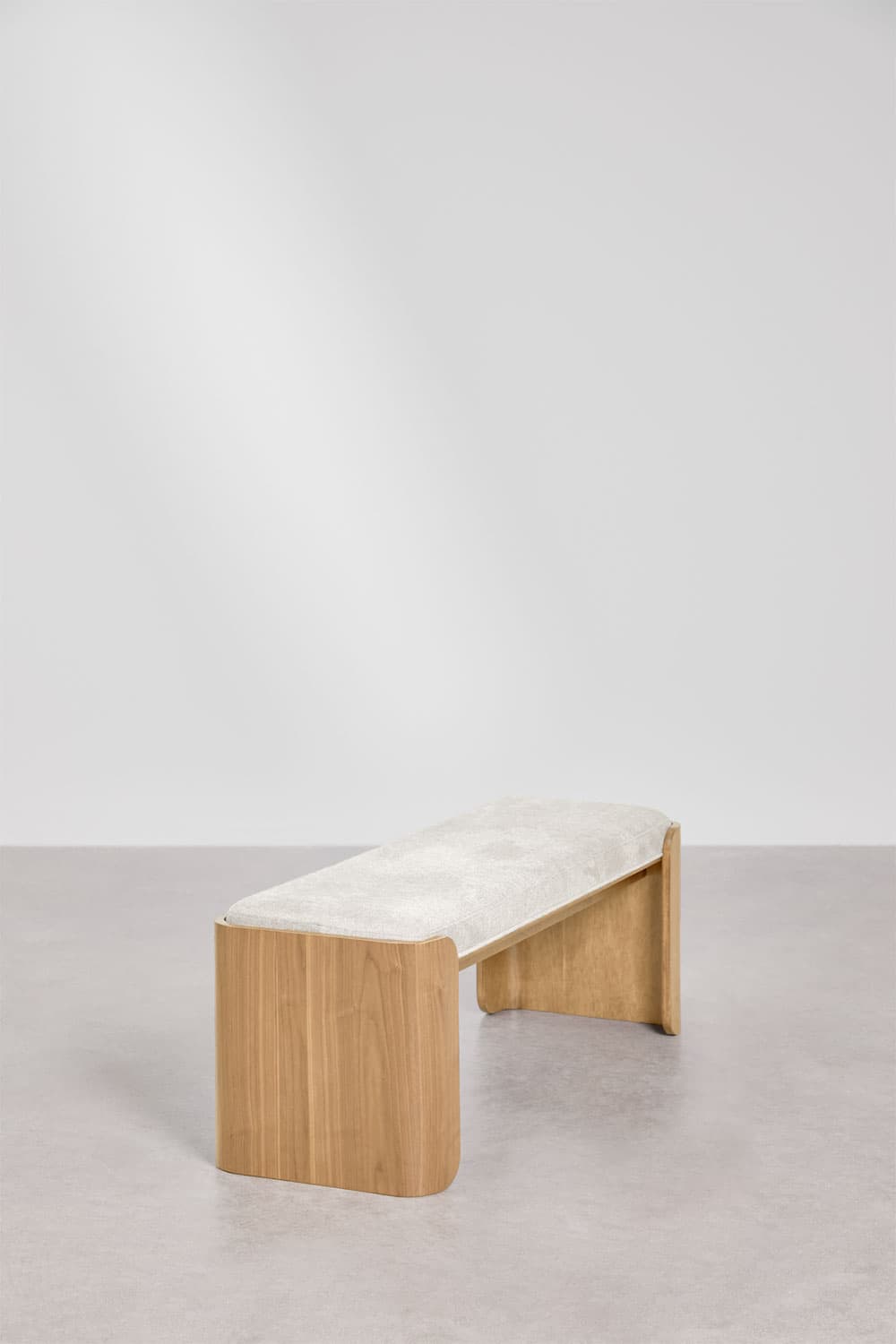 A modern bench featuring a light-colored upholstered seat and a natural wood base with a distinctive curved, waterfall-like design. — 3D model
