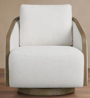 A contemporary swivel armchair featuring light off-white textured upholstery and an exposed, curved light-toned wood frame that outlines the armrests and back. The chair rests on a circular, low-profile swivel base matching the wood frame. — 3D model