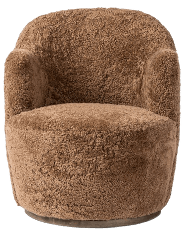 A plush, upholstered armchair with a rounded silhouette. The chair features a barrel-shaped base and a high, enveloping backrest that curves into armrests. The upholstery has a textured, shaggy appearance, resembling sheepskin or a similar natural fiber. — 3D model