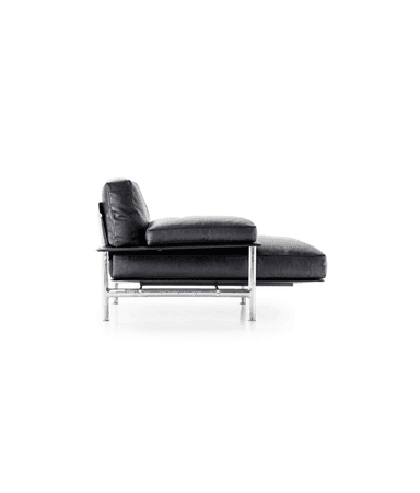 A three-seater sofa upholstered in black leather. The sofa features a sleek, modern design with thin metal legs and armrests that extend outward as flat platforms. The seat and back cushions are plush and appear to be filled with a soft material. Integrated side tables on the armrests are a notable design element. — 3D model