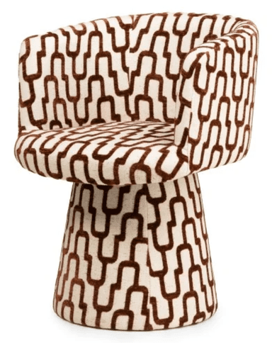 A modern armchair with a rounded, upholstered form. The chair features a high back that curves into armrests, enclosing the seating area. The base is a tapered pedestal, also upholstered, providing stability. The upholstery displays a geometric pattern of interlocking U-shapes in brown on an off-white background. — 3D model