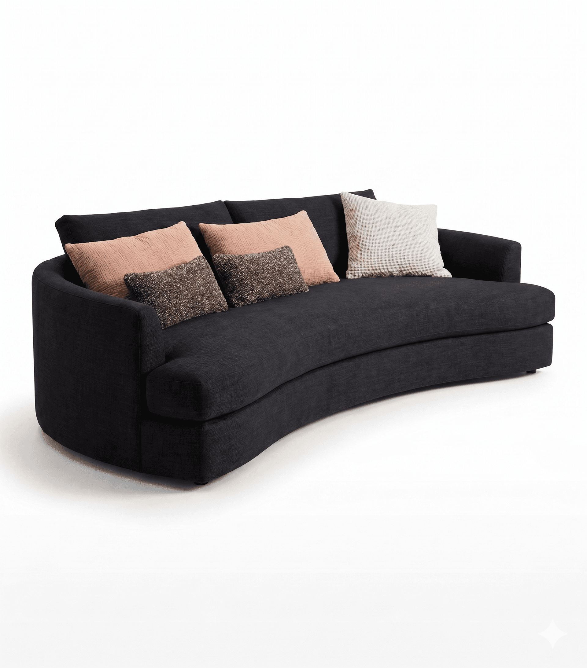 A curved sofa with a dark grey fabric upholstery. It features a low profile and a wrap-around armrest. The sofa is adorned with three throw pillows: two rectangular in a muted peach color with a textured finish, and one square in a cream color with a chunky knit pattern. A smaller rectangular pillow with a speckled brown and white textured pattern is placed in front of the peach pillows. — 3D model