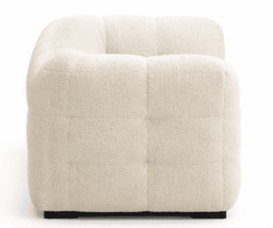 A modern three-seater sofa upholstered in a creamy, off-white boucle fabric. The sofa features a distinctive tufted design, creating a plush, segmented appearance across the backrest, seat, and arms. It has low, rounded arms and a solid, block-style base in black or dark brown, providing a contemporary aesthetic. — 3D model