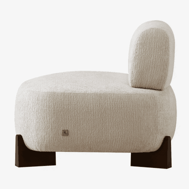 A contemporary armchair with a rounded, organic form. It features a plush, textured upholstery and a low profile supported by dark, angular legs. — 3D model