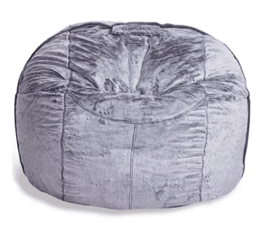 A round, amorphous bean bag chair upholstered in a grey, mottled faux fur fabric, featuring visible stitching that creates a segmented appearance. A small fabric handle is present at the top. — 3D model