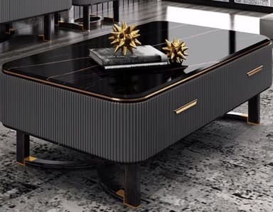 A rectangular coffee table featuring a polished black marble top with delicate gold veining. The body of the table is dark, possibly black wood, with distinct fluted or reeded paneling on the long sides. It incorporates two drawers, indicated by gold-toned bar handles. The table rests on a unique base composed of two dark-toned, possibly wood or metal, curved elements with gold-toned accents, providing a modern and sophisticated aesthetic. — 3D model