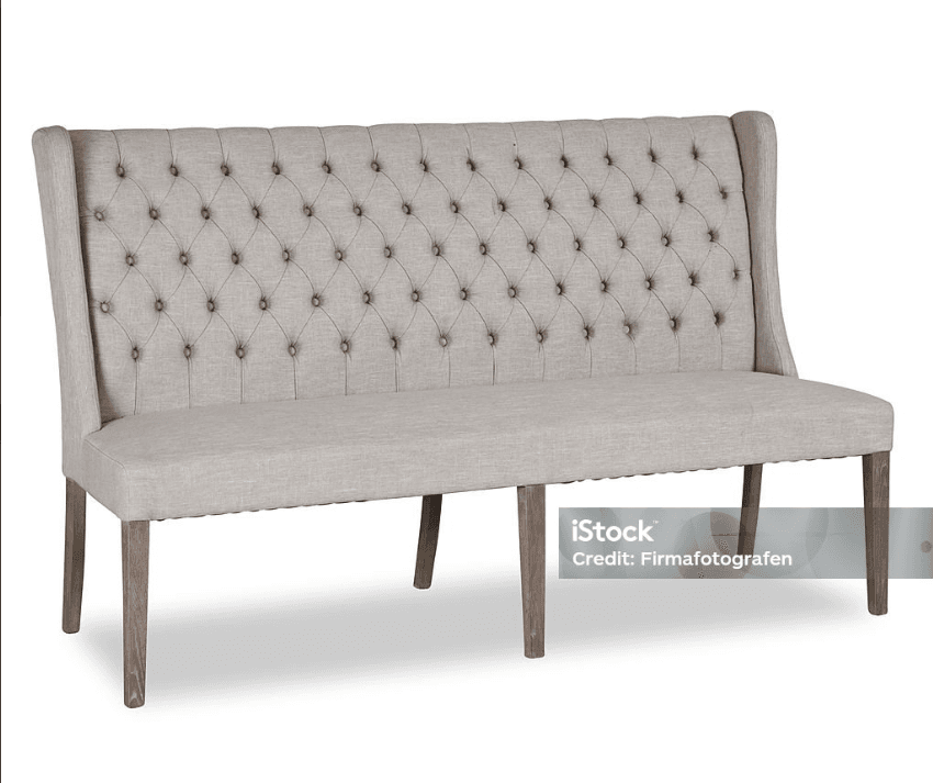 A tufted upholstered bench with a high back and wingback sides, supported by four wooden legs. The upholstery features a diamond tufted pattern secured by buttons. The legs are tapered and have a distressed wood finish. — 3D model