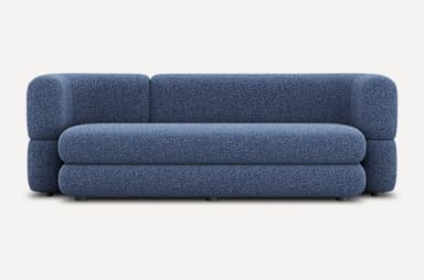 A low-profile, modular sofa with rounded edges and a textured fabric upholstery. The sofa appears to be constructed from densely packed foam or similar cushioning material. It features a distinct layered design for both the seat and backrest. Small, dark cylindrical legs support the base. — 3D model