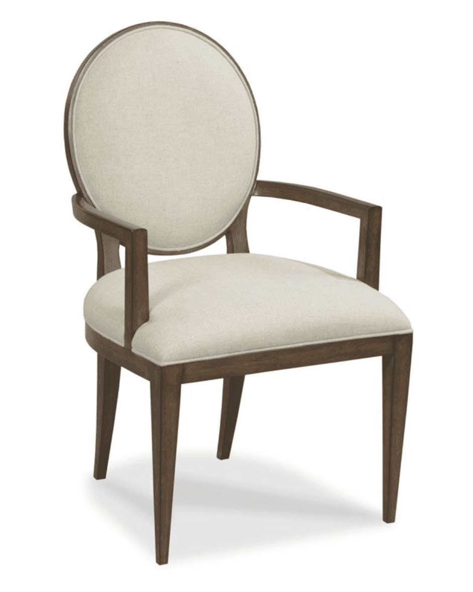 A wooden armchair with upholstered seat and backrest. The armchair features a circular, upholstered backrest framed by wood, and a similarly upholstered seat. It has four tapering legs and wooden arms that curve gently downwards. — 3D model