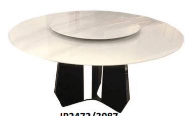 A modern round dining table featuring a high-gloss white tabletop with an integrated, rotating lazy susan. The table is supported by a sculptural, multi-faceted black base. The contrasting colors and sleek lines give it a contemporary aesthetic. — 3D model