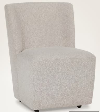 A fully upholstered armless accent chair featuring a light beige, textured boucle fabric. The chair has a minimalist design with a continuous, integrated backrest and seat, soft rounded edges, and no visible legs, presenting a solid, block-like silhouette. — 3D model