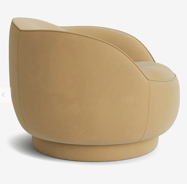 A modern, upholstered armchair with a rounded silhouette and a swivel base. The chair features a low, enveloping backrest that curves into the armrests, creating a continuous, soft form. The seat is also rounded and plush. The entire piece is covered in a textured fabric and rests on a cylindrical, self-finished base that allows for rotation. — 3D model
