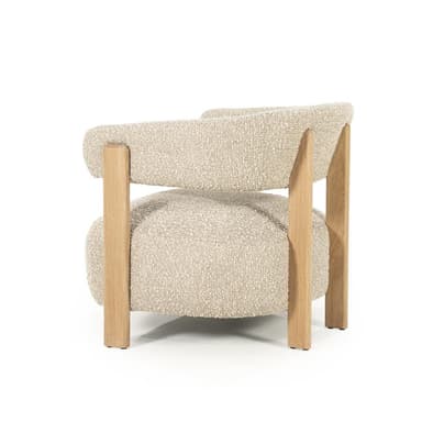 A modern armchair with a textured boucle upholstery and a wooden frame. The chair features a rounded seat and backrest, supported by four visible wooden legs and structural elements. The arms are integrated into the backrest structure. — 3D model