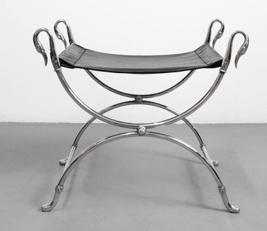 A polished chrome-plated metal and black leather X-frame stool, featuring a sling-style seat and decorative swan-head finials on the frame. — 3D model