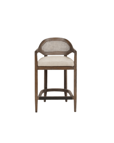 A bar stool with a wooden frame, featuring a woven cane backrest within an oval frame, and a cushioned seat. The stool has armrests and four legs connected by a lower footrest structure. — 3D model