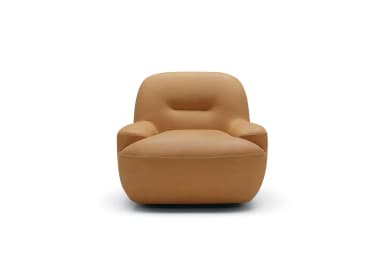 A single, tan-colored, plush armchair featuring a contemporary design with soft, rounded edges and a fully upholstered form. It has integrated armrests and a subtle horizontal indentation on the backrest, suggesting a comfortable lumbar or design feature. The material appears to be smooth leather or a high-quality leatherette, contributing to its sleek, modern aesthetic. — 3D model