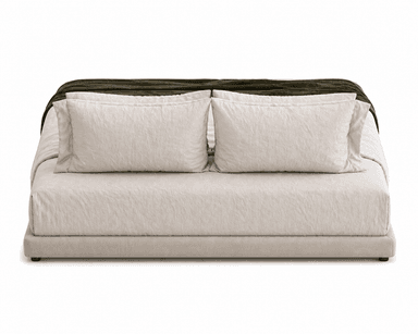 A low-profile upholstered bed frame with a headboard composed of three pillows and bedding. A folded blanket is draped across the foot of the bed. — 3D model