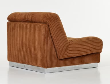 A brown, heavily upholstered lounge chair component with a ribbed corduroy fabric texture, featuring a plush, low-profile design and a slim silver-toned metal plinth base. — 3D model