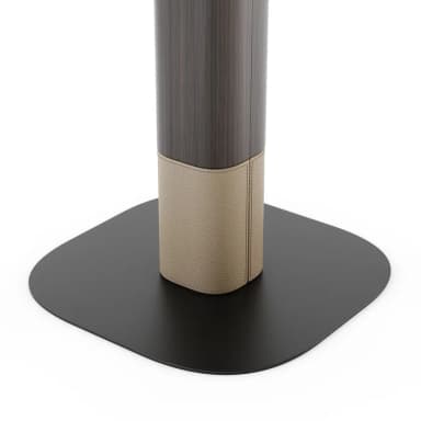 A modern side table featuring a dark wood finish on its tabletop and upper pedestal, contrasted with a lighter, textured material on the lower pedestal, all supported by a flat, dark rectangular base with rounded corners. — 3D model