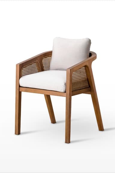 A contemporary armchair featuring a light-toned wooden frame, cane webbing back and side panels, and white upholstered cushions for the seat and backrest. — 3D model