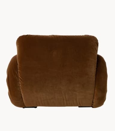 A plush, sculptural armchair upholstered in a rich brown velvet fabric. The armchair features an organic, rounded silhouette with ample cushioning that appears to be gathered or shirred, creating a textured effect. A tubular metal frame, finished in a light, possibly cream or off-white color, is visible beneath the upholstery, providing structural support and a contrasting element. The design evokes a contemporary, possibly retro-inspired aesthetic. — 3D model