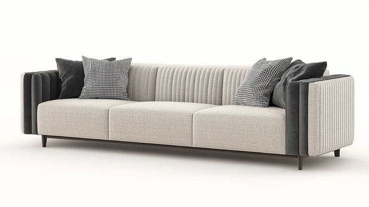 A long, contemporary three-seater sofa featuring channel-tufted armrests and back panels in a dark contrasting fabric, combined with lighter textured fabric for the seat cushions and central backrest. It sits on discreet, dark-colored legs. — 3D model