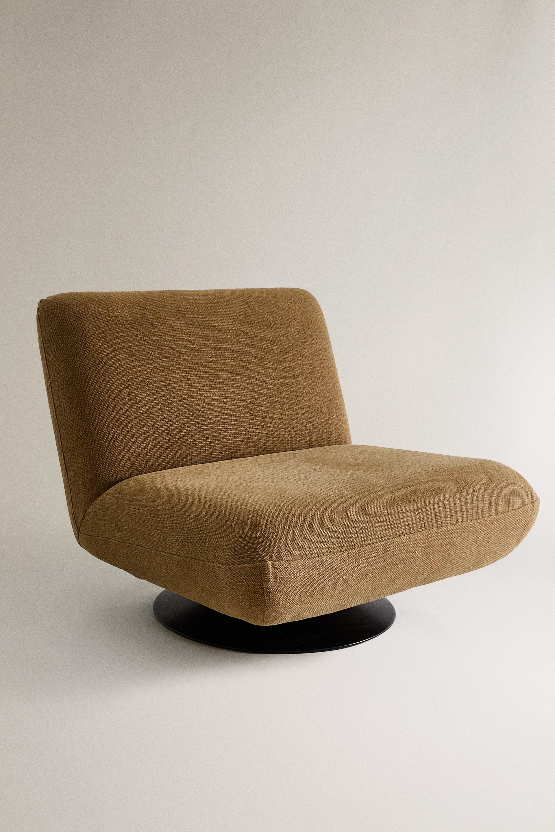 A modern armless swivel lounge chair upholstered in a brown woven fabric, featuring a low profile and a circular black base. — 3D model