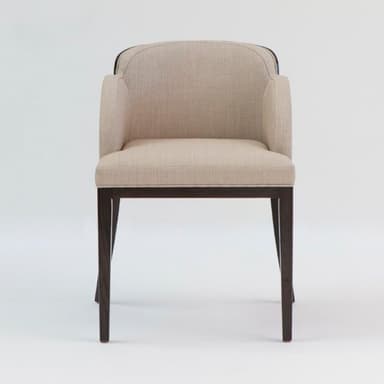 An upholstered armchair featuring a curved backrest and integrated arms, set on a dark wood frame with four legs. The upholstery is a light beige or tan fabric. — 3D model
