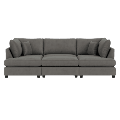 A modular three-seater sofa with a low profile and deep seating. It features thick, plush seat cushions and back cushions. The sofa is upholstered in a textured, matte gray fabric. Accent pillows are placed on either end, angled against the back cushions. The sofa rests on short, dark, block-style legs. — 3D model