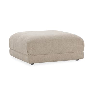 A rectangular ottoman with softly rounded corners, upholstered in a textured, woven fabric. The ottoman has a low profile and appears to be well-padded. It is supported by four small, dark-colored feet, barely visible beneath the base. — 3D model
