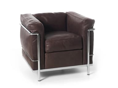 A modernist armchair featuring a visible, polished chrome-plated tubular steel frame and plush, dark brown leather cushions. The chair has a distinctive boxy silhouette, with separate cushions for the seat, back, and armrests. The external frame envelops the upholstered components, creating a stark contrast between the industrial metal and the soft leather. The design is compact and features clean, geometric lines, characteristic of early 20th-century modern design. — 3D model