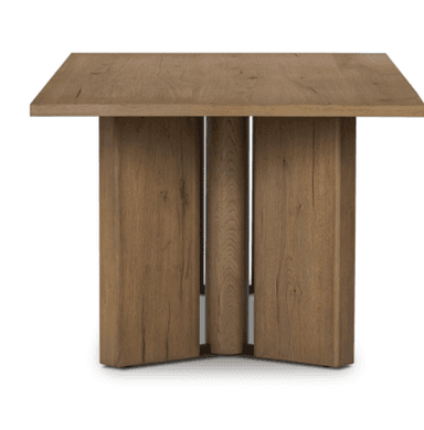 A long, rectangular dining table made of light brown wood, featuring a thick tabletop and two sturdy, rectangular block-like bases. — 3D model