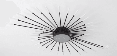 A modern Sputnik-style ceiling light fixture featuring a central black circular base from which numerous black metal arms radiate outwards, each tipped with a white, frosted cylindrical light diffuser. The arms are arranged in a dynamic, starburst-like configuration, some appearing to spiral slightly, providing a wide and multi-directional light distribution. — 3D model